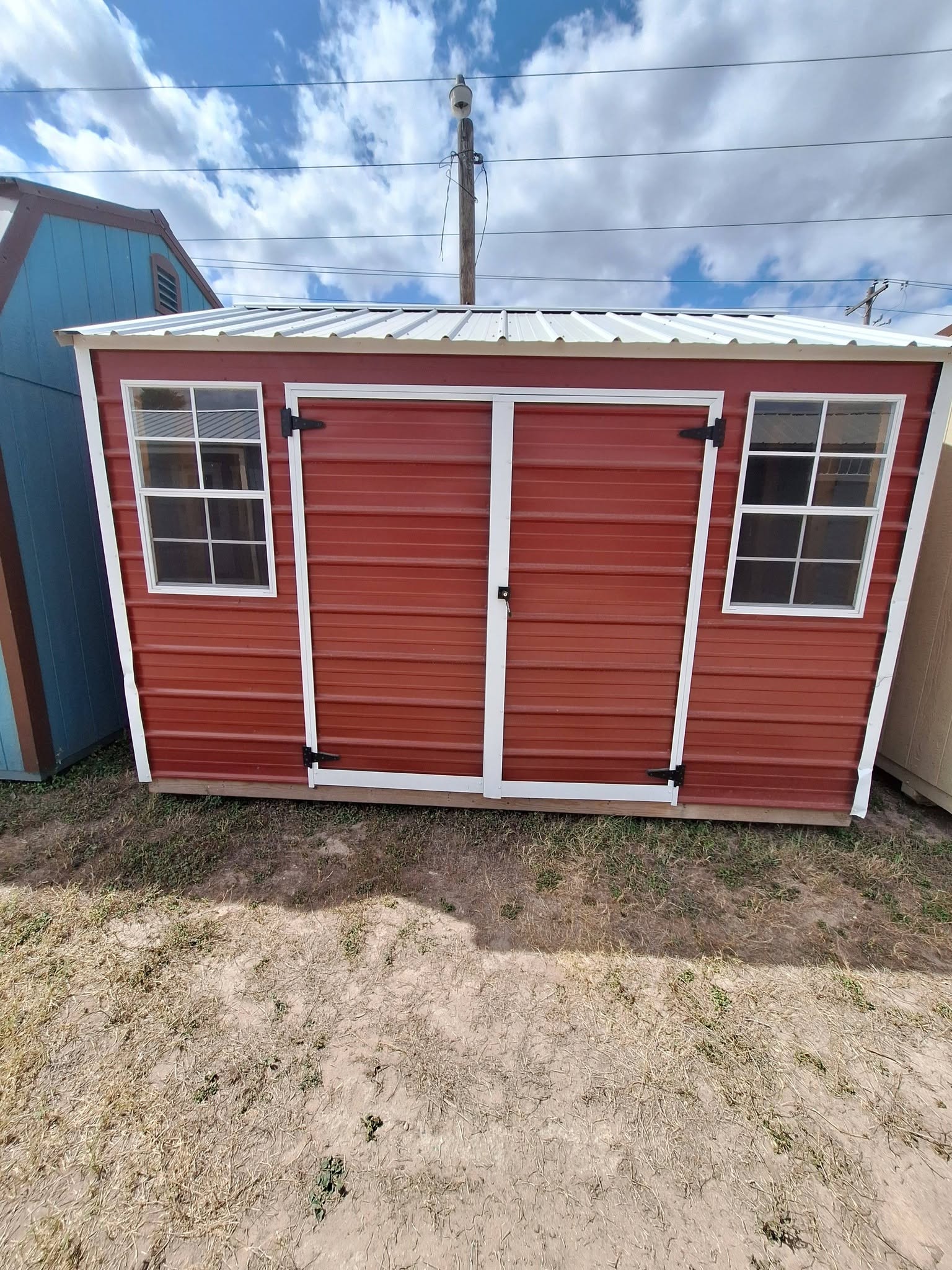 Lofted barn storage shed set up as a backyard workshop in the Rio Grande Valley
