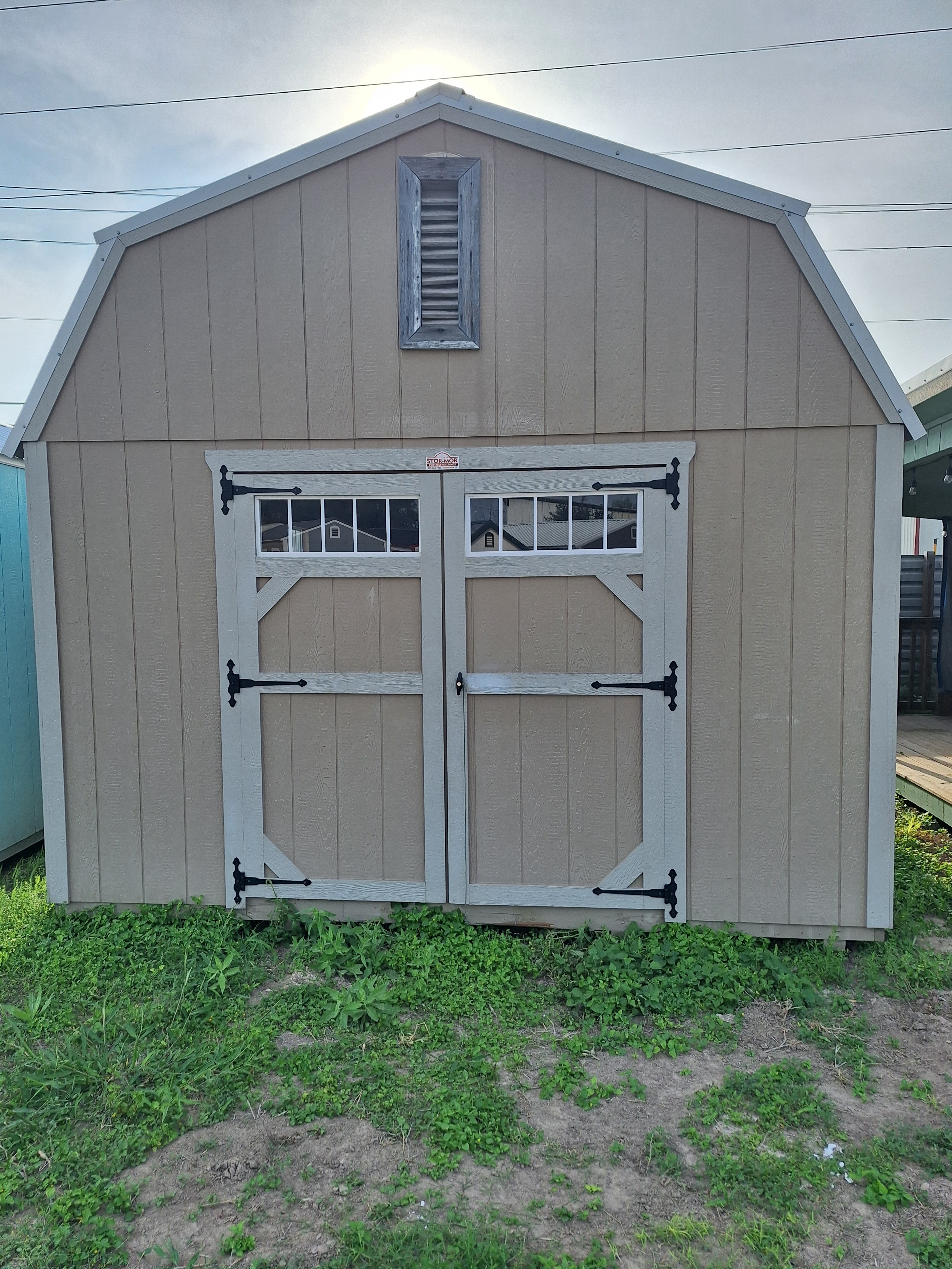 Custom building with double doors on the Mesquite Sheds & More lot in Alamo, TX