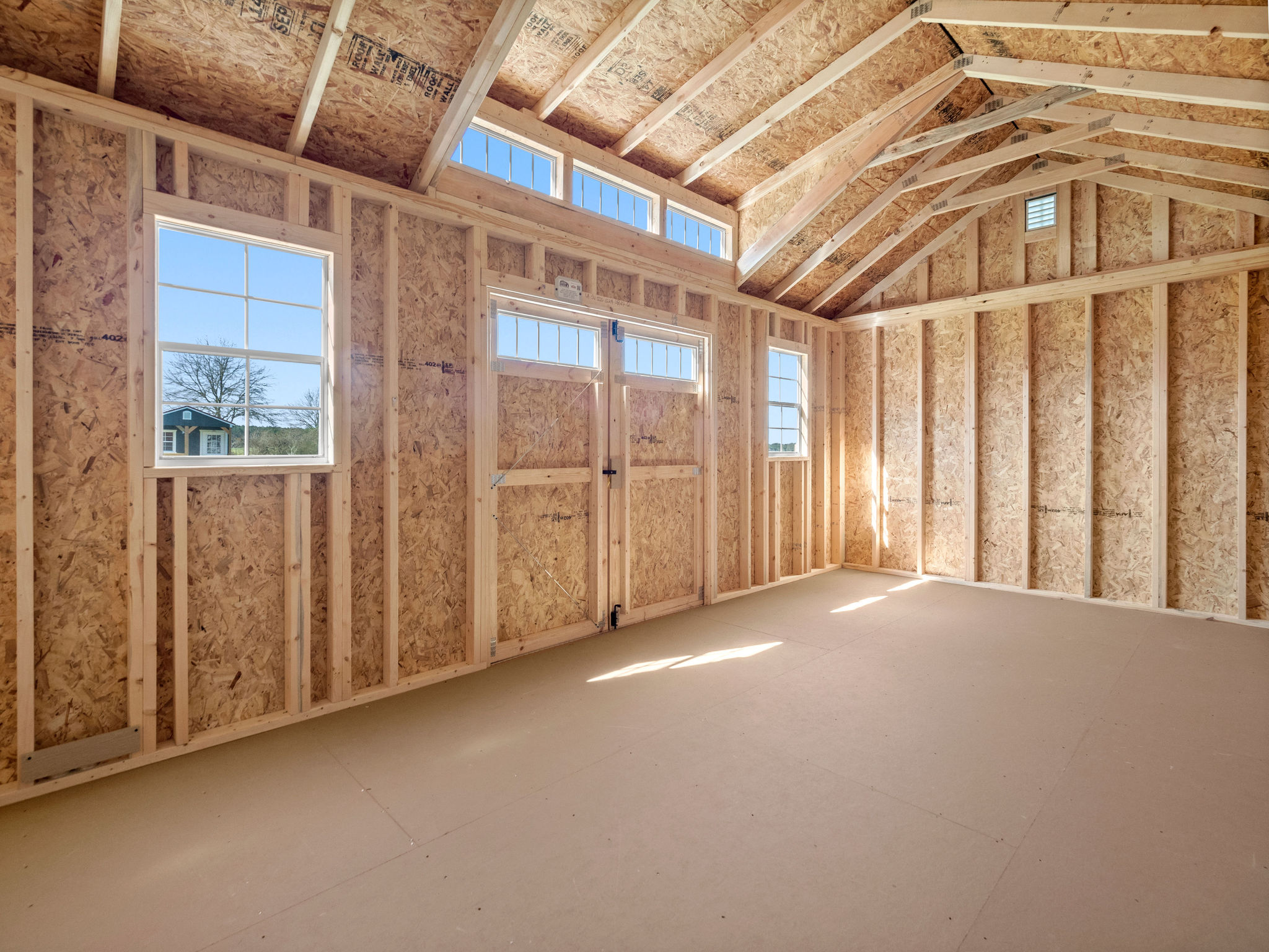 Unfinished shell interior of a cabin shed, ready for Smart Space finishing