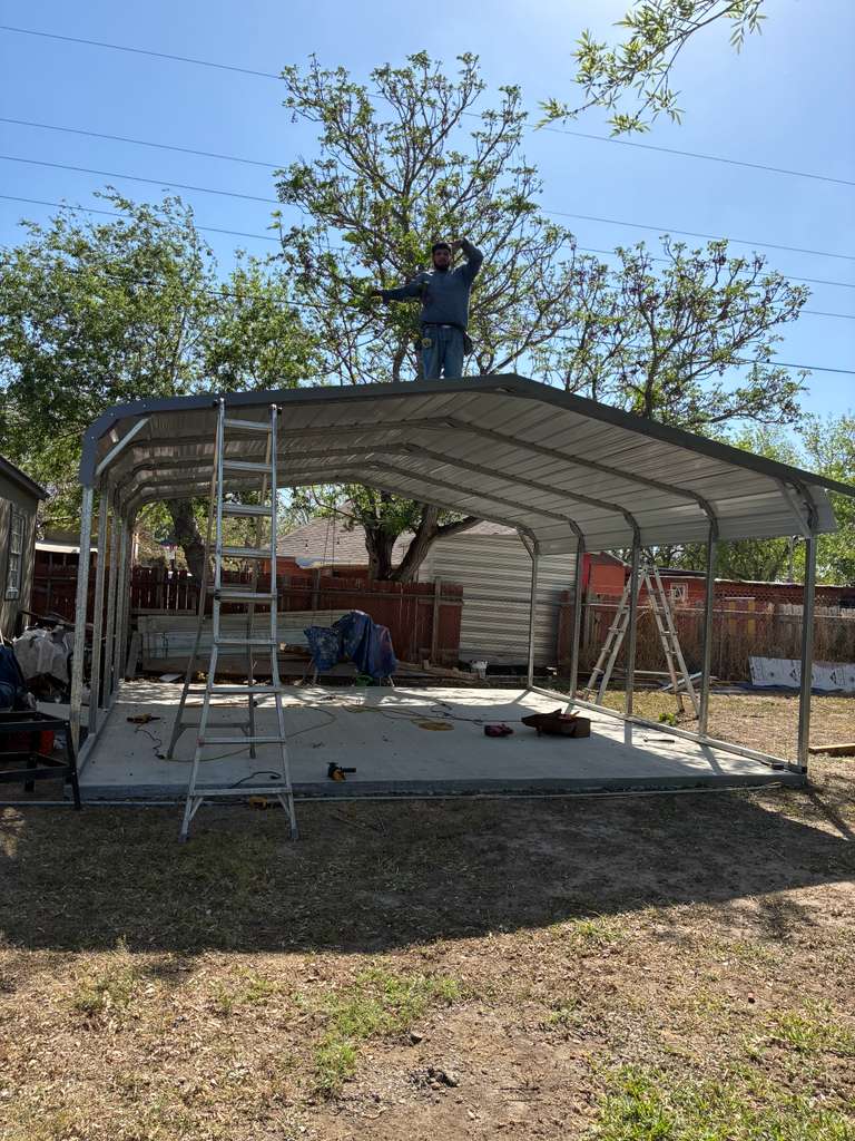 Metal carport set up in a backyard for a home in Edinburg, TX