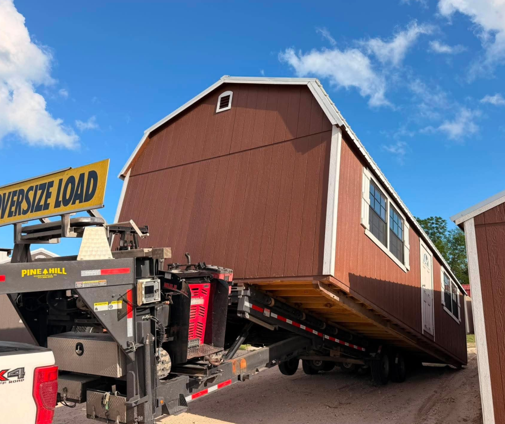 Customer picking up a new storage shed at the Mesquite Sheds & More lot in Alamo, TX