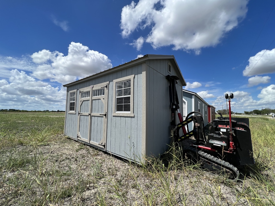 Storage shed being delivered and set up at a customer's home near McAllen, TX