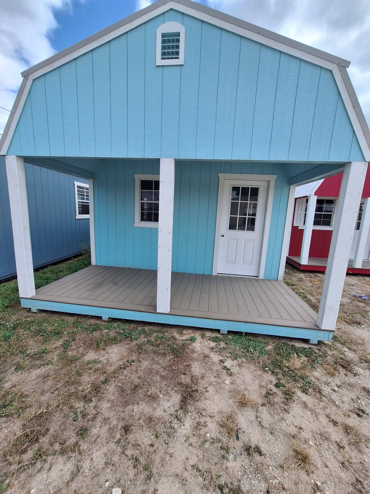 Portable cabin with a front porch on the lot in Alamo, TX
